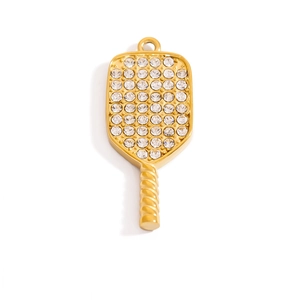 Macro detail of golden pickleball racket pendant with sparkling rhinestone inlay