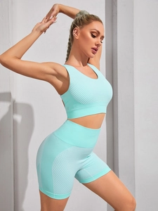Detailed close-up of light blue seamless yoga set showing ribbed honeycomb texture fabric