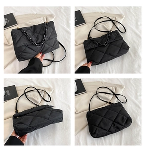 Detail views of black quilted shoulder bag with chain decoration and adjustable strap