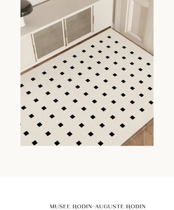 Detail of French minimalist cream PVC mat with black geometric pattern on wood floor