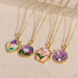 Elegant gold necklaces with enamel floral pendants and natural freshwater pearls