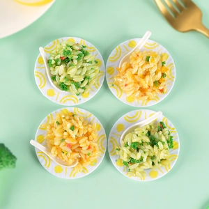 Miniature fried rice food models with spoons on a light green aesthetic background
