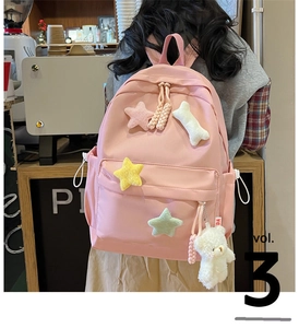Pink minimalist canvas backpack with cute plush star patches and teddy bear charm for girls