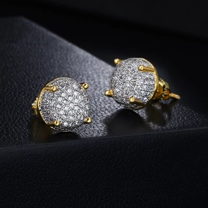 Close-up of gold iced-out stud earrings with micro-pave white zircons and four-prong setting