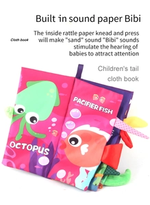 Detail of baby cloth book with 3D marine animal tails and built-in sound paper and squeaker