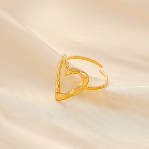 Detail of gold hollow heart ring featuring a unique hammered lava texture and open band