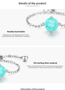 Macro detail of S925 sterling silver chain with light blue Paraiba tourmaline stone