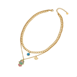 Double-layered gold necklace with Evil Eye and Hamsa Hand enamel pendants on white background