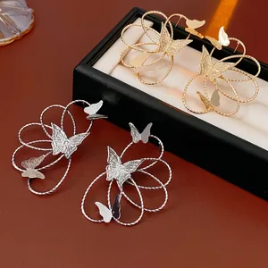 Exquisite hollow butterfly earrings in gold and silver finish with elegant twisted line texture