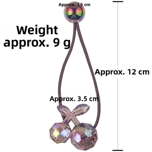 Detail of a purple cherry hair tie with faceted iridescent beads and elastic band