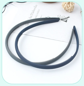 Detailed view of gray and dark blue matte headbands with non-slip teeth for secure grip