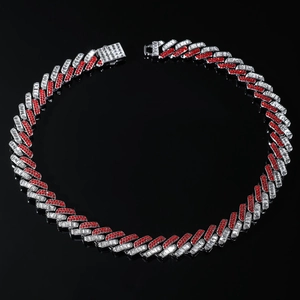 Detail of 15mm cuban chain featuring red and white rhinestones on black background