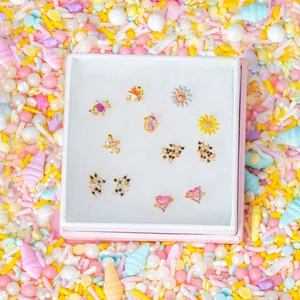 Detailed view of 18K gold plated earring set with colorful zircon and enamel shapes