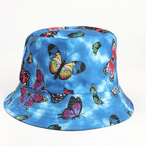 Close-up of blue tie-dye bucket hat featuring colorful butterfly prints and stitched brim