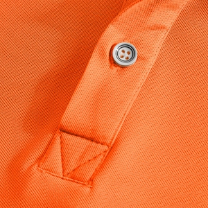 Close-up of bright orange piqué polo shirt collar showing the button placket and fabric texture