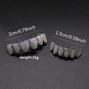 Macro detail of silver iced out hip hop grillz set with size and weight measurements