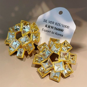 Golden sunburst earrings with transparent square zirconia and 925 silver studs