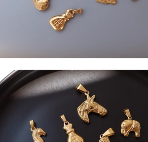 Macro shot of 18K gold plated animal pendants including horse head and elephant charms