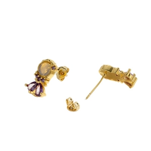 Elegant gold fishtail earrings featuring purple and amber zircons on a white background