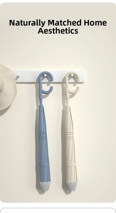 Detail of C-shaped umbrella handles with hollow star design on blue and beige fabric