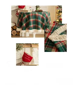 Detail of red and green Christmas plaid tablecloth with white fringe tassels