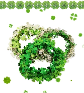 Detailed view of Saint Patrick's Day green clover tinsel garlands with metallic shamrocks