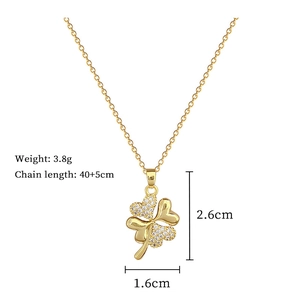 Detailed view of gold clover necklace with crystal inlay and technical dimensions