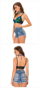 Detail view of high waist distressed denim shorts with sequin top and frayed fringe edges