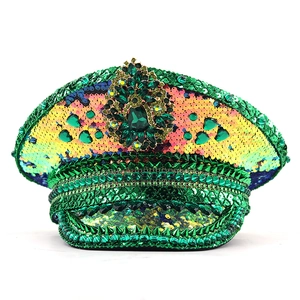 Detailed view of green sequined captain hat with emerald gemstones and studs for festival party