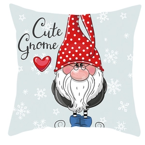Close-up of cute gnome print on peach skin pillowcase with snowflakes and red hearts
