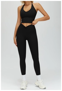 Detail of black halter yoga bra and V-shape cross waist high rise leggings