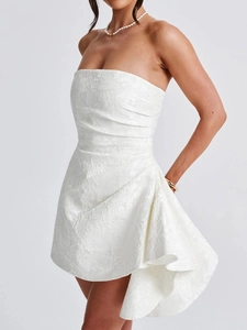 Close-up of white strapless lace mini dress with asymmetric ruffled side detailing