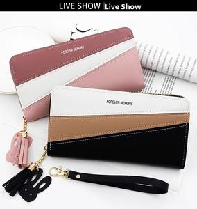 Detailed view of tricolor long wallets with zipper closure, tassels and bunny charms