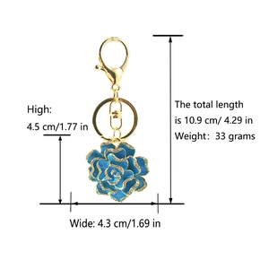 Detailed size and weight specs for blue enamel flower keychain with rhinestones