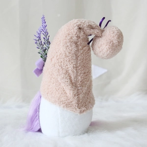Close-up of plush Valentine gnome with pink hat, lavender bouquet and purple hair