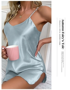 Close-up of light blue satin nightgown showing v-neckline and smooth silky fabric texture