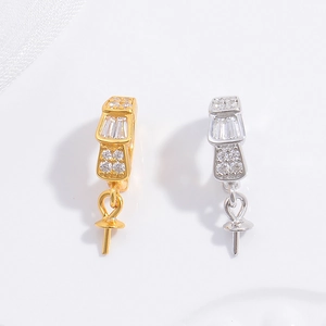 Close-up of S925 silver and gold jewelry bails with glittering cubic zirconia stones