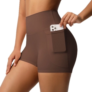 High-waisted brown yoga shorts for women with side pockets and compressive fit