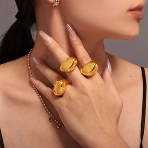 Chunky irregular 18K gold plated stainless steel rings with a polished organic finish