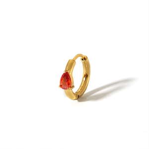 Detail of 18K gold plated hoop earring with a pear-cut orange zircon drop charm