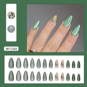 Cat eye forest green press-on nails with clover and yellow flower almond nail art set