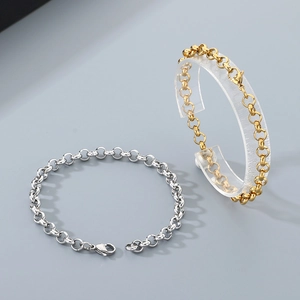 Detail of high-polished stainless steel pearl link chain bracelet with lobster clasp