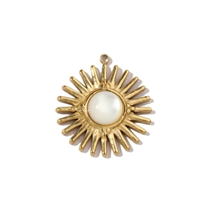 Detailed macro view of a golden sun pendant featuring a white round shell stone inlay