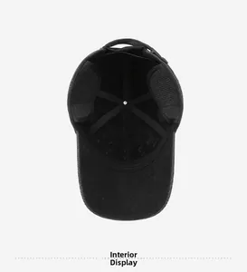 Detail view of winter baseball cap interior with fold-down ear flaps and warm lining