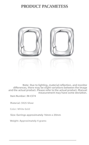Macro shot of irregular wavy 925 sterling silver earrings in white gold finish