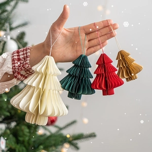 Mini honeycomb paper Christmas tree ornaments in vintage colors hanging for holiday decor