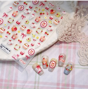Detail of 3D embossed strawberry bear nail stickers with rococo floral patterns
