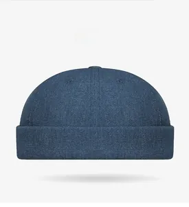 Front view of a dark blue denim docker hat with rolled edge and retro stitch detail