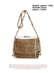 Detail of straw woven crossbody bag with bead accents showing dimensions 25x21cm