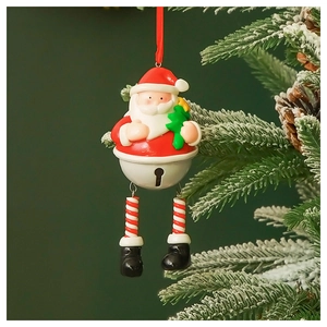 Detail of Santa Claus bell ornament with red silk rope hanging on a snowy Christmas tree